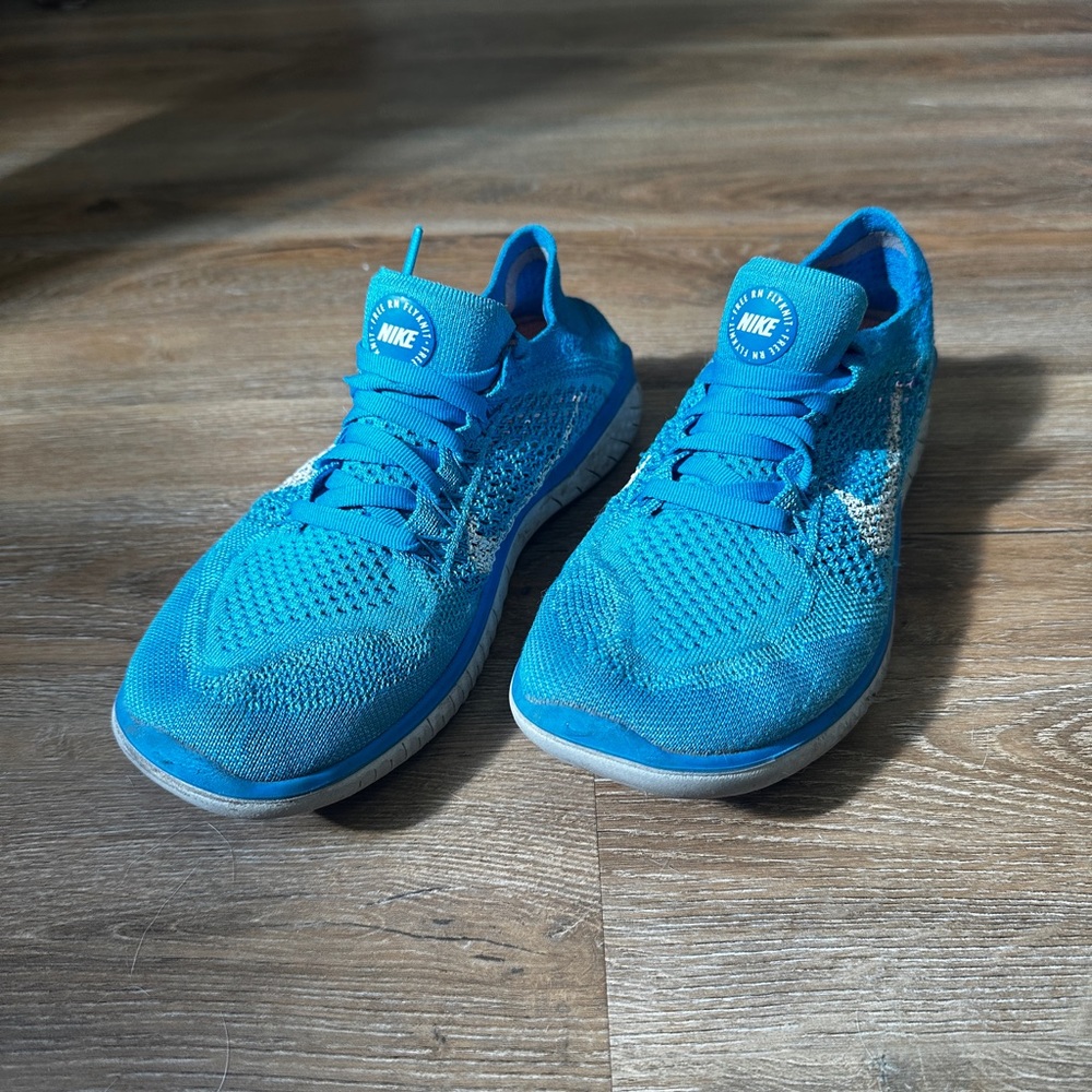 Blue Nike free running shoes